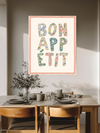 Bon Appetit typography print with wildflower-filled letters framed in a styled kitchen