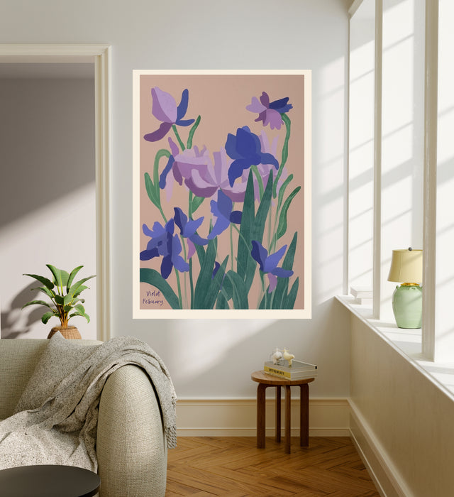 Purple violet birth month flower art print hanging in a sunlit living room above a linen armchair with side table and plant