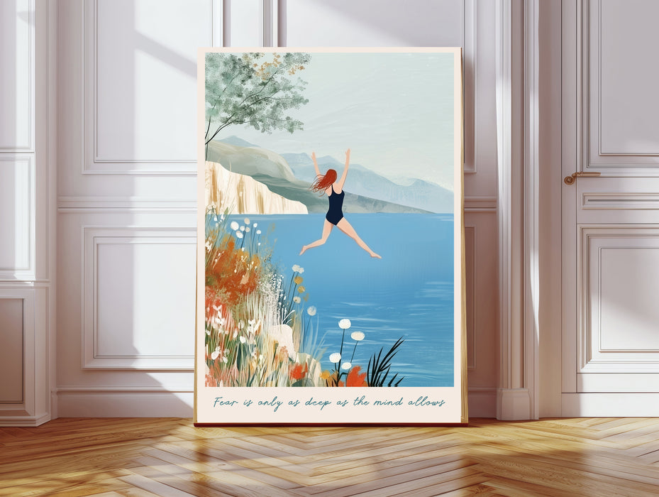 Wild swimming art print in a gold frame with the quote Fear is only as deep as the mind allows, woman jumping into a blue lake with wildflowers and mountains