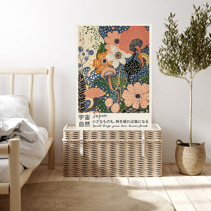 Peach and blue Japanese floral quote art print resting on a wicker chest beside a bed and olive tree in a neutral bedroom