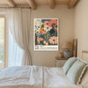 Japanese polka dot floral art print on a beamed bedroom wall with linen curtains and sage green bedding