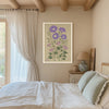 Purple aster birth month flower print on a beamed bedroom wall with linen curtains and sage green bedding