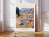 Japanese mountain garden art print with the quote A journey of a thousand miles begins with a single step, colourful blossoming valley and blue peaks, leaning against a panelled wall