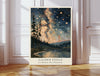 La Danse des Planetes starry night lake print with Milky Way and pine trees, leaning against a white panelled wall