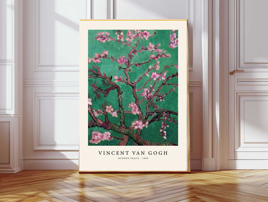 Van Gogh Almond Blossom art print in emerald green with pink blossoms, cream border, displayed above a rattan basket in a neutral bedroom
