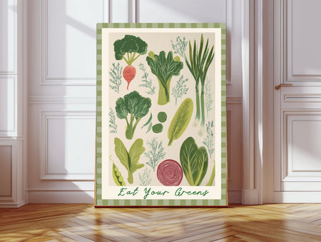 Eat Your Greens fine art print featuring hand-painted broccoli, leeks, celery and pea pods with a sage green striped border, leaning against a white panelled wall