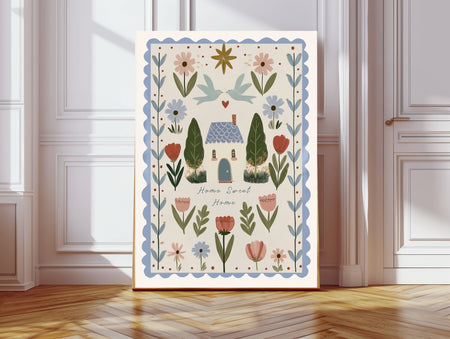 Home Sweet Home folk art print with cottage, doves and wildflowers, leaning against a white panelled wall