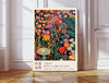 Midnight wildflower meadow art print in a gold frame with the Japanese proverb Beauty grows in the places no one's watching, coral and marigold blooms on black