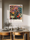 Beauty grows where no one's watching midnight meadow print above a wooden dining table with olive branches and stoneware