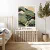 Green Japanese garden art print resting on a wicker chest beside a bed and olive tree in a neutral bedroom