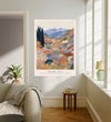 Japanese landscape quote art print hanging in a bright living room above a linen sofa, colourful mountain garden with Japanese proverb