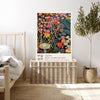 Dark floral Japanese quote art print resting on a wicker chest beside a bed and olive tree in a neutral bedroom