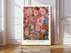 Klimt inspired pink poppy garden art print with coral poppies and blue cornflowers, cream border, leaning against a white panelled wall