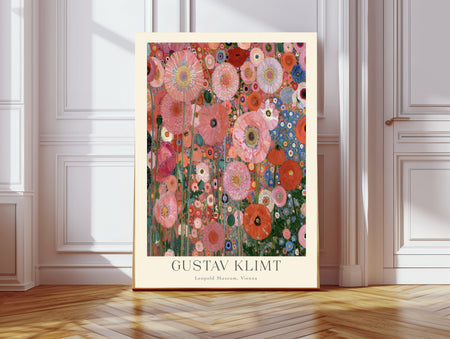 Klimt inspired pink poppy garden art print with coral poppies and blue cornflowers, cream border, leaning against a white panelled wall