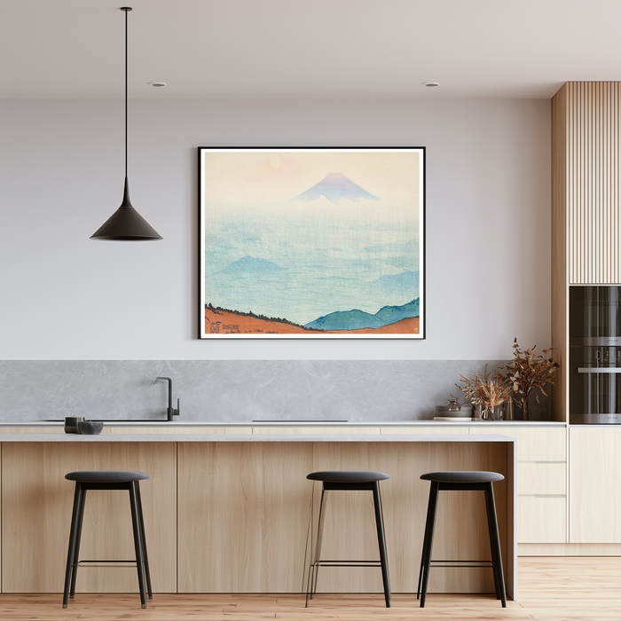Pastel blue and coral Mount Fuji woodblock art print framed above a sofa