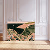Blush pink and sage green seaside wall art with clifftop flowers and a little cottage by the sea