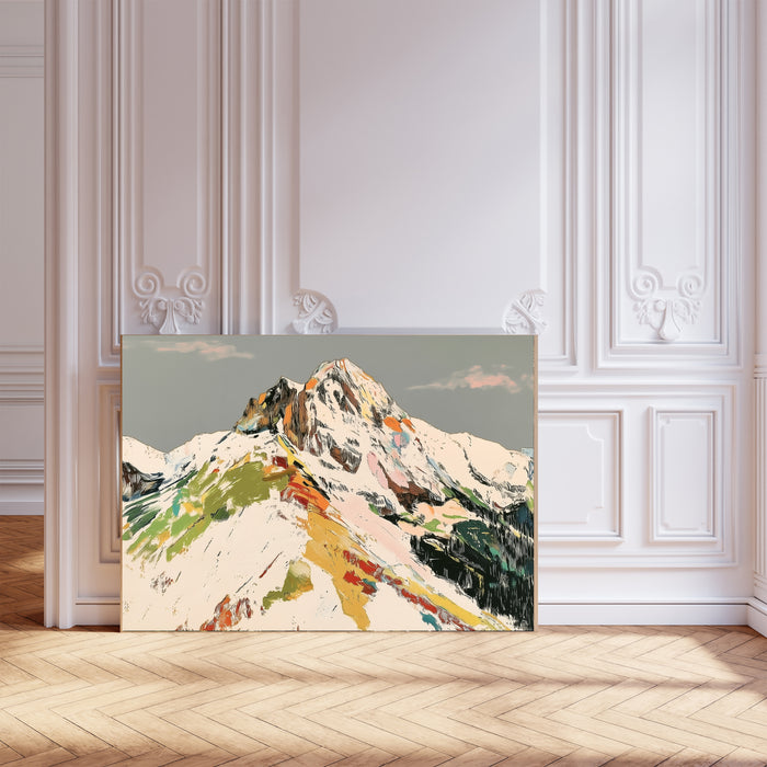 Colourful abstract snowy mountain art print with green, yellow, red and pink brushstrokes on a grey sky, landscape format, leaning against a white panelled wall