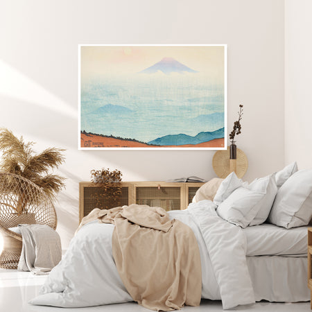 Mount Fuji rising above misty blue clouds, vintage Japanese landscape print in a calm room