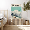 Vintage ski mountain landscape poster resting on a rattan trunk in a neutral bedroom with olive tree