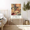 Vintage mushroom exhibition poster print resting on a wicker chest beside a bed and olive tree in a neutral bedroom
