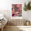 Pink fungi Japanese quote art print resting on a wicker chest beside a bed and olive tree in a neutral bedroom