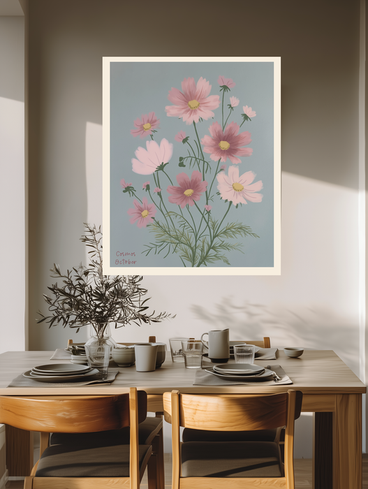 Pink cosmos birth month flower print above a wooden dining table with olive branches and stoneware