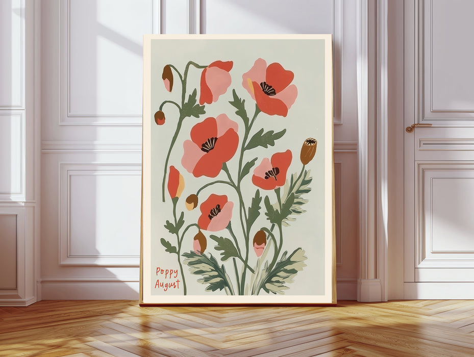 August birth flower art print of red and pink poppies in a gold frame, Poppy August lettering, leaning against a panelled wall