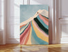 Retro ski mountain print on a warm neutral dining room wall above an oak table set for two