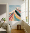 Contemporary skier wall art in a sunlit living room above a wooden side table with boucle armchair