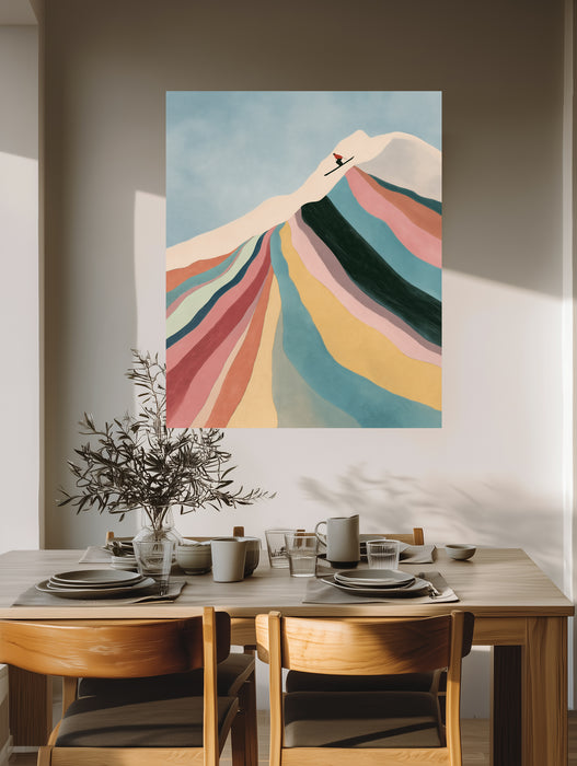 Large colourful ski mountain canvas leaning against a white panelled wall on a herringbone wood floor