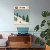 Framed Japanese ski print above a mid century sideboard with record player and monstera plant