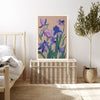 February violet birth flower print resting on a wicker chest beside a bed and olive tree in a neutral bedroom